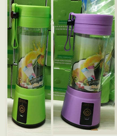 Two portable blenders, one green and one purple, with a colorful design on a white surface.