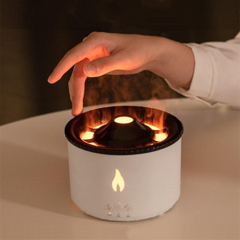 Hand interacting with a small, white flameless candle-like device on a neutral background