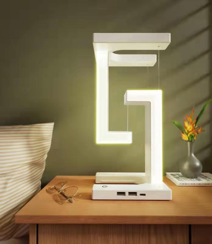 Modern LED desk lamp on a wooden nightstand with a cozy bedroom setting.