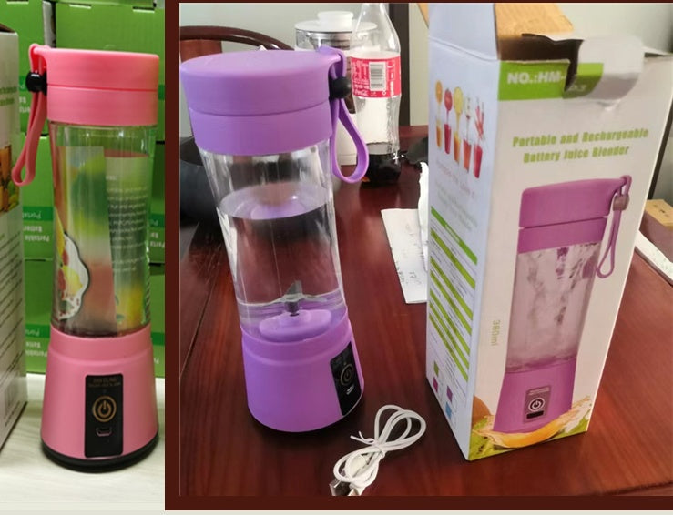 Purple portable juice blender with pink lid on a table next to its packaging