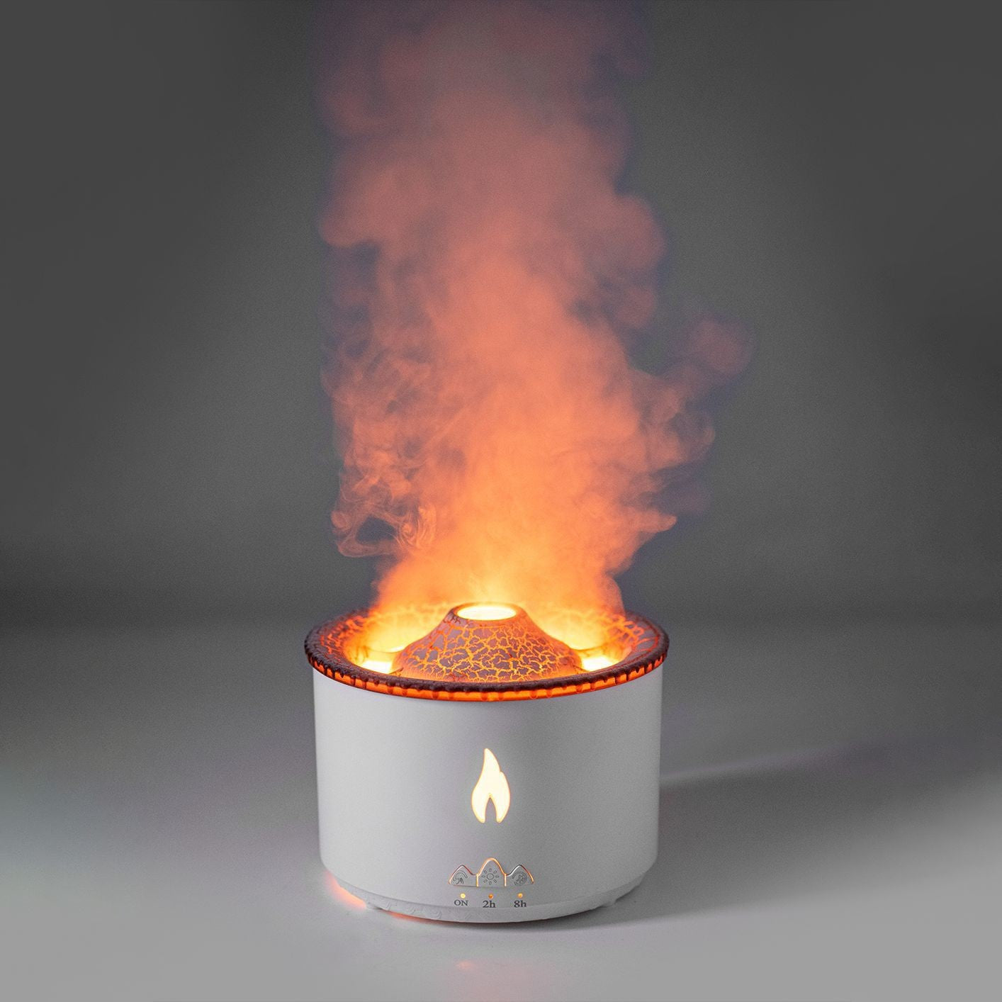 White cylindrical device with flames and smoke on a gray background