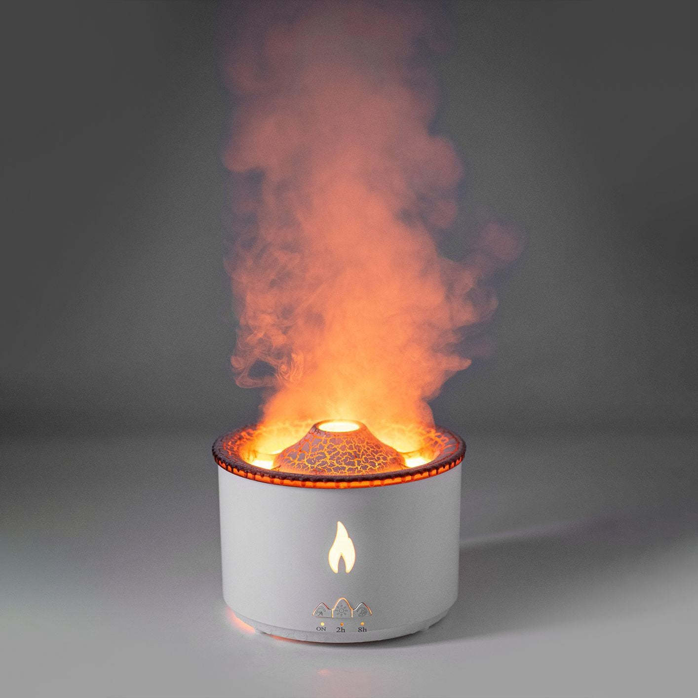 White cylindrical device with flames and smoke on a gray background