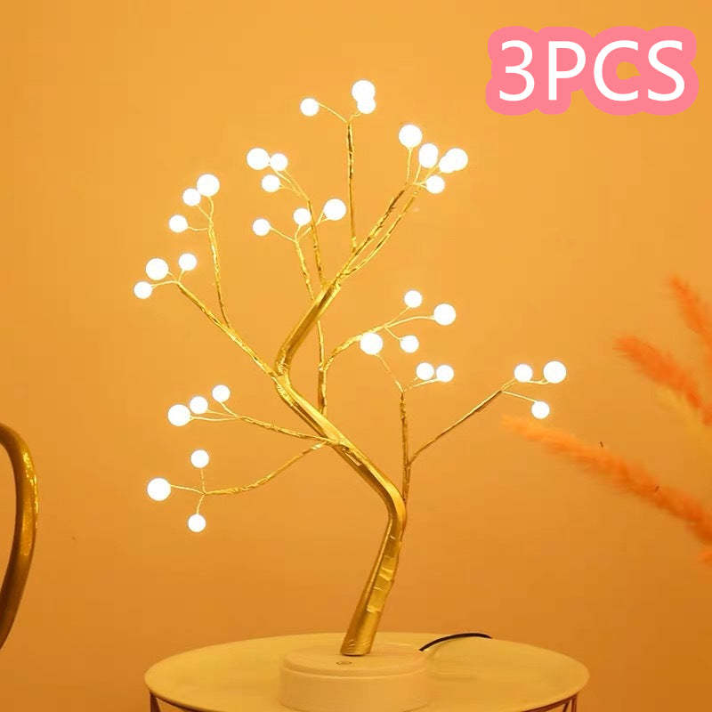Decorative LED branch light on a stand with '3PCS' text in pink on an orange background