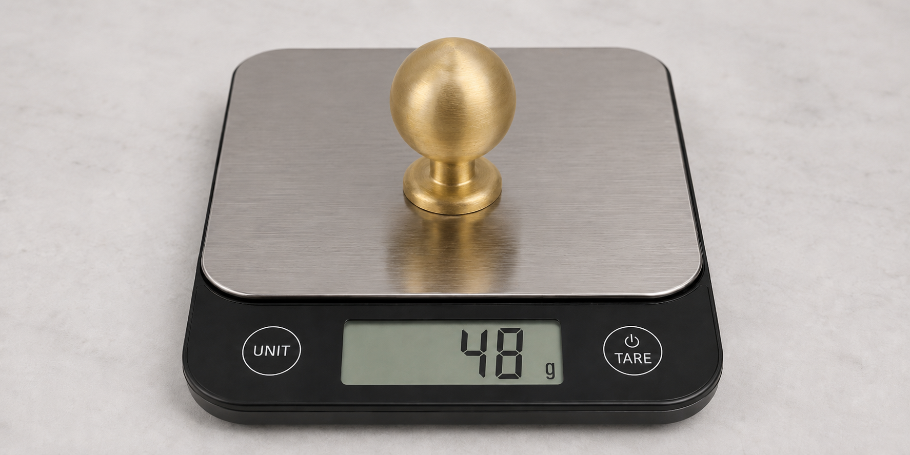 solid brass knob on scale showing 48 grams