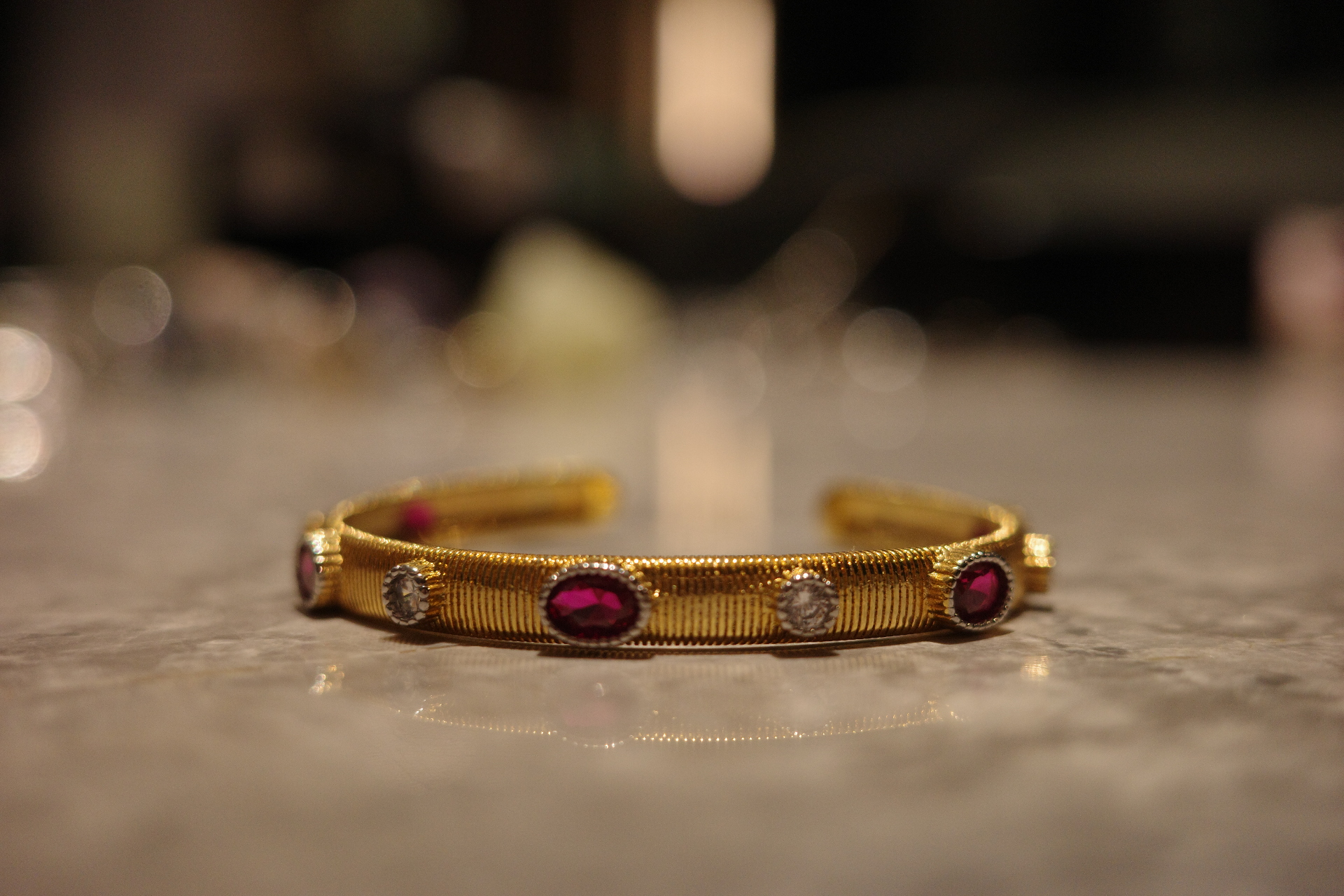 The Saturn Sovereign Cuff – Gilded Silk Engraving & Crimson Corundum Centerpiece