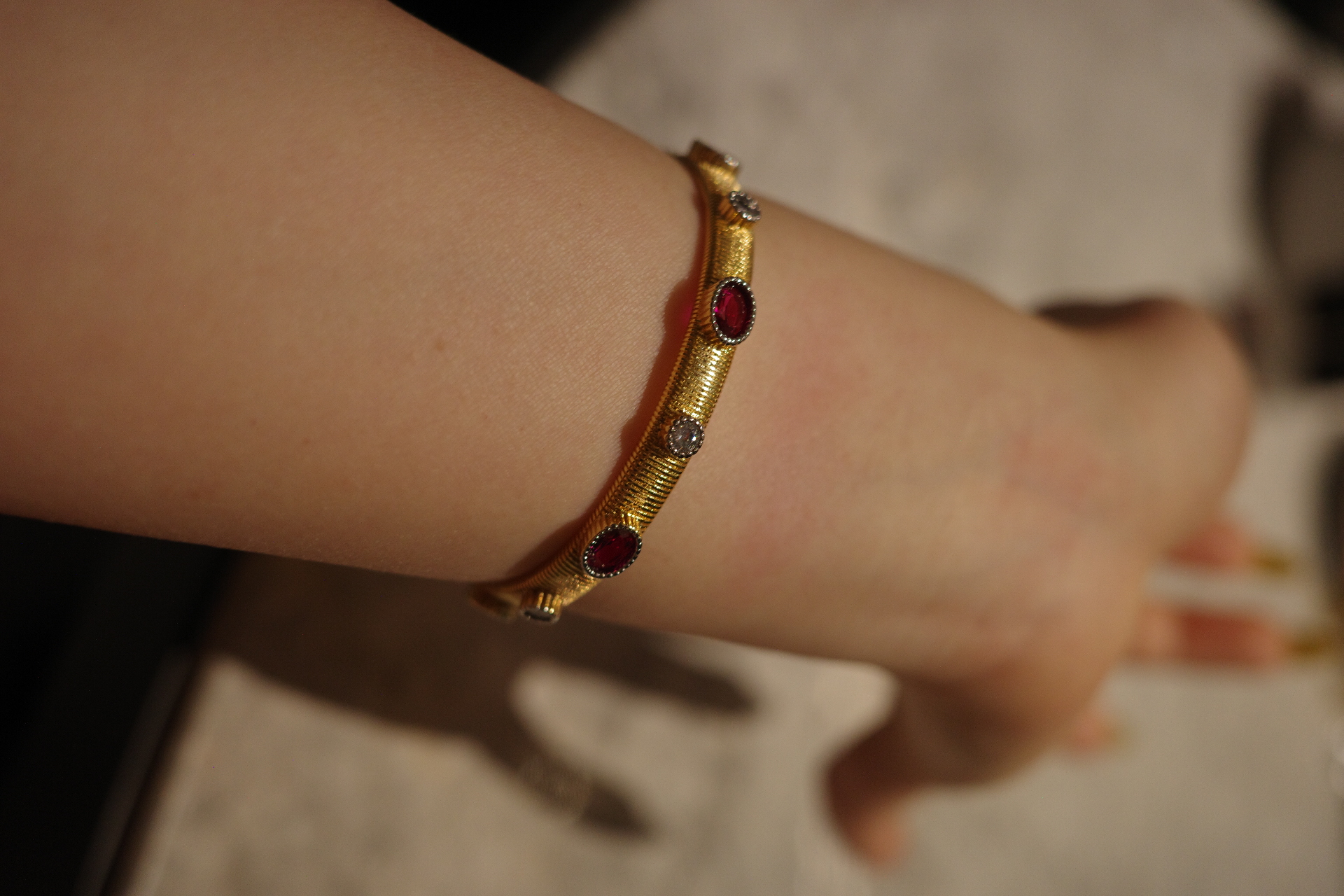 The Saturn Sovereign Cuff – Gilded Silk Engraving & Crimson Corundum Centerpiece
