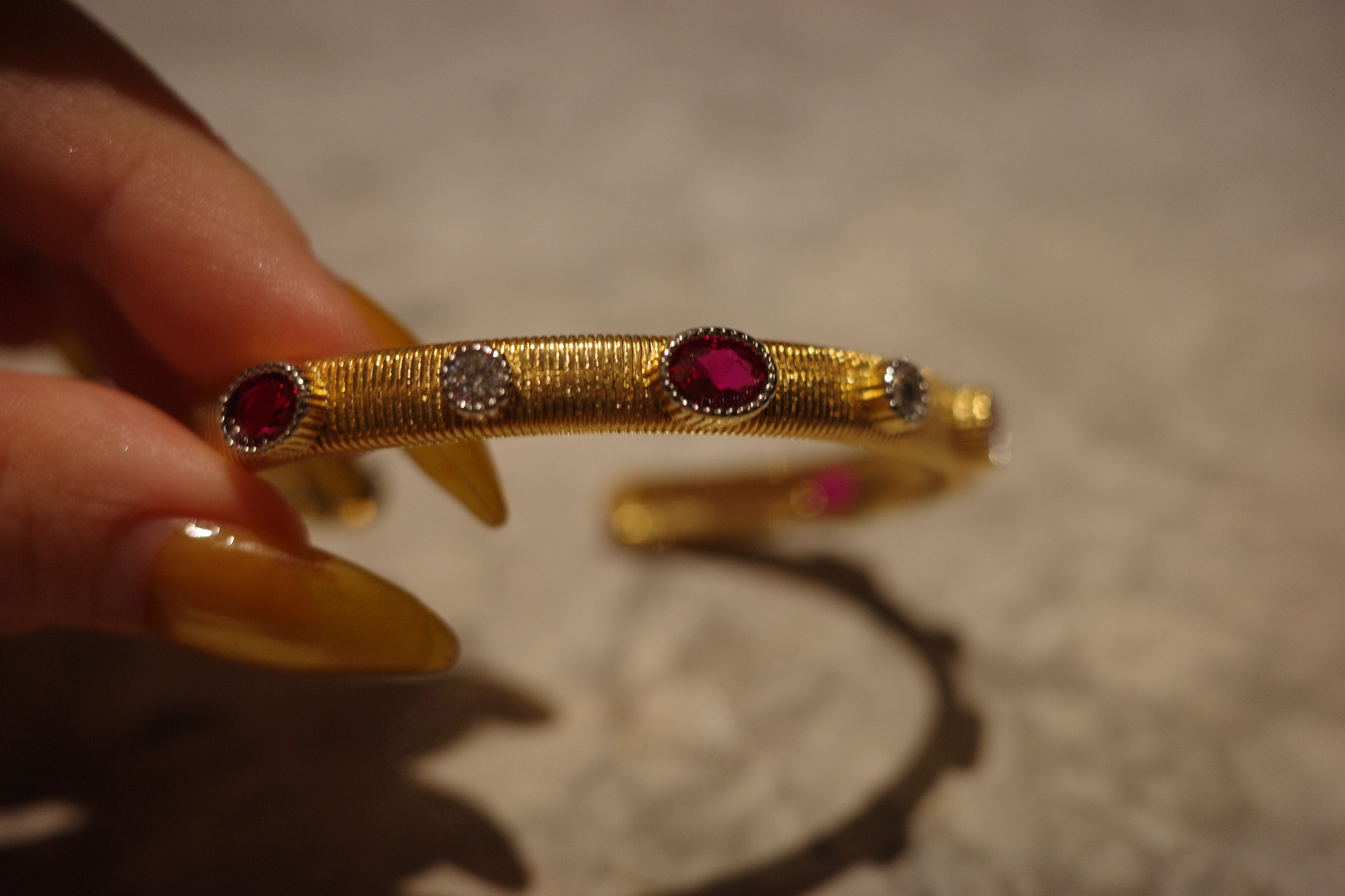 The Saturn Sovereign Cuff – Gilded Silk Engraving & Crimson Corundum Centerpiece