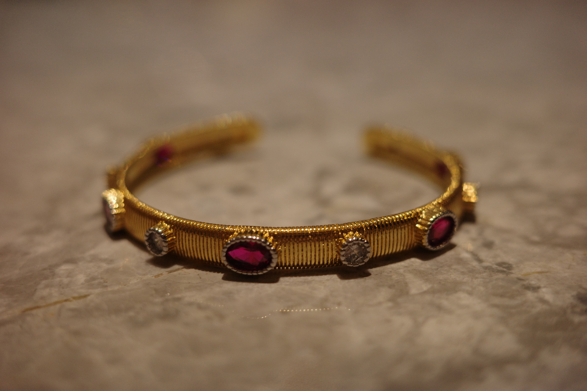 The Saturn Sovereign Cuff – Gilded Silk Engraving & Crimson Corundum Centerpiece