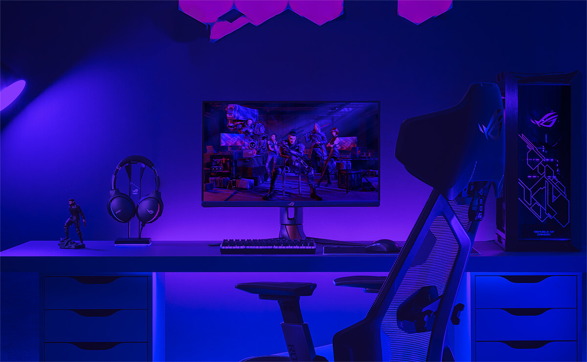 ROG gaming setup with a PC, monitor, keyboard, mouse, and headset.