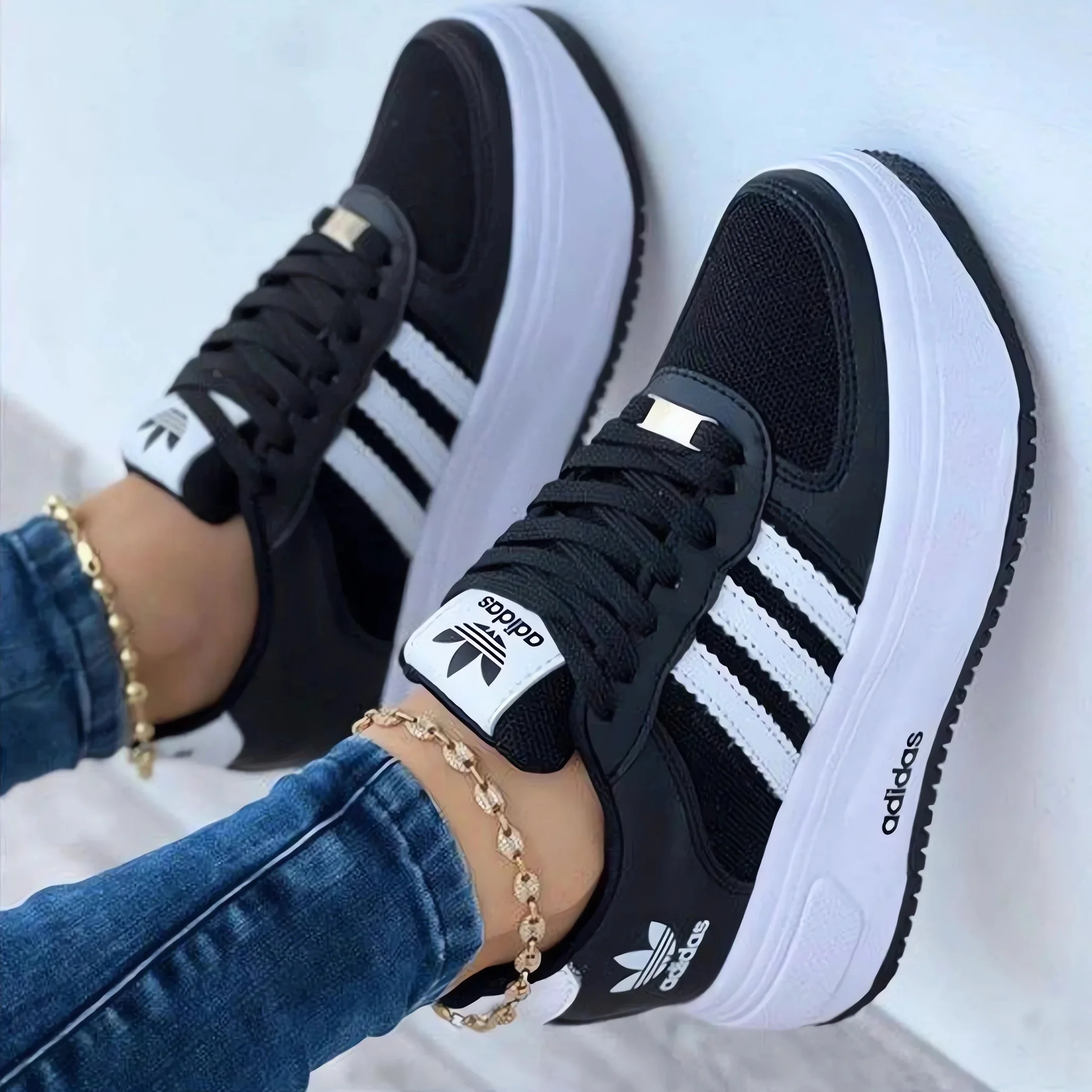 Adidas® women's leather sneakers