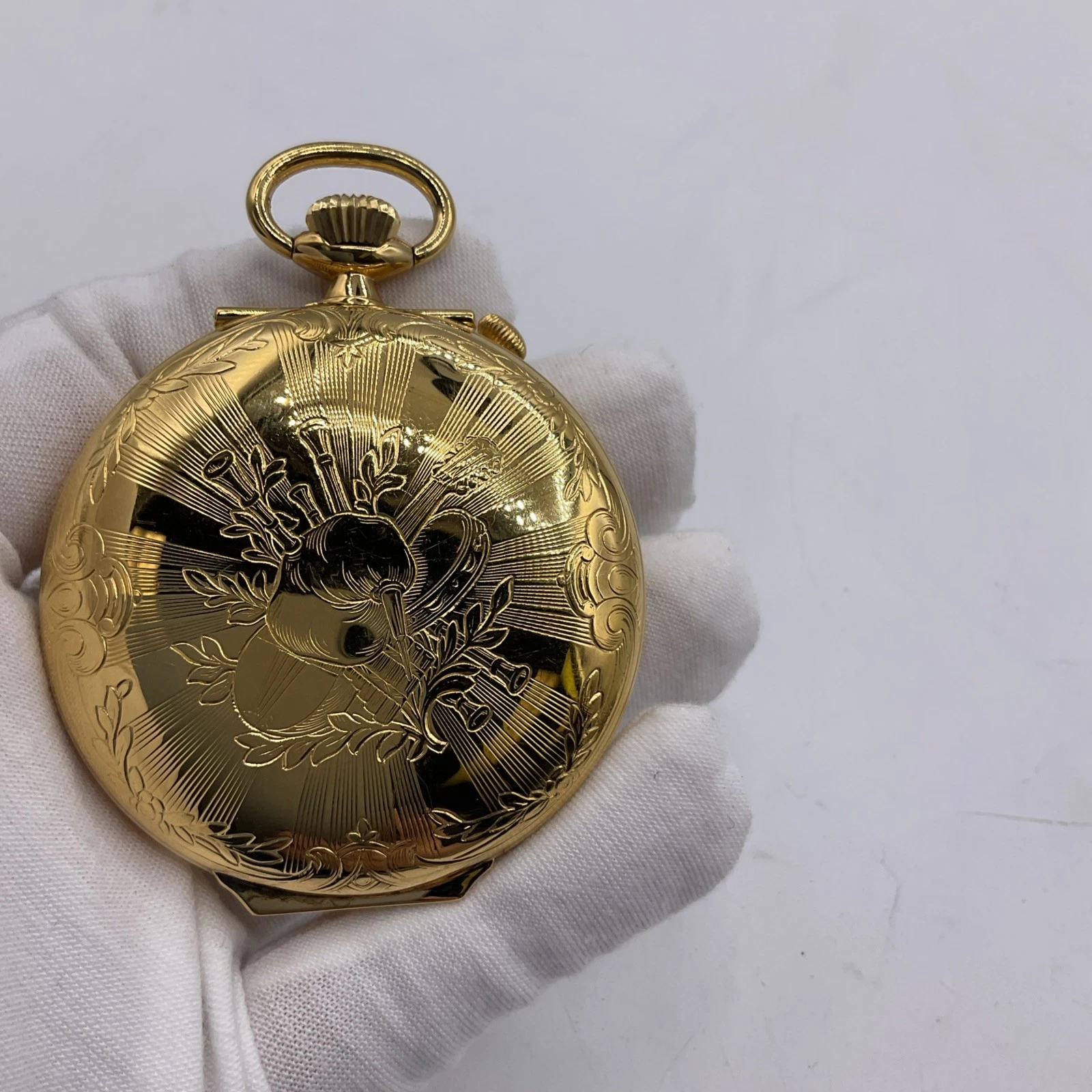 Timeless Treasure: Gold-Tone Musical Pocket Watch
