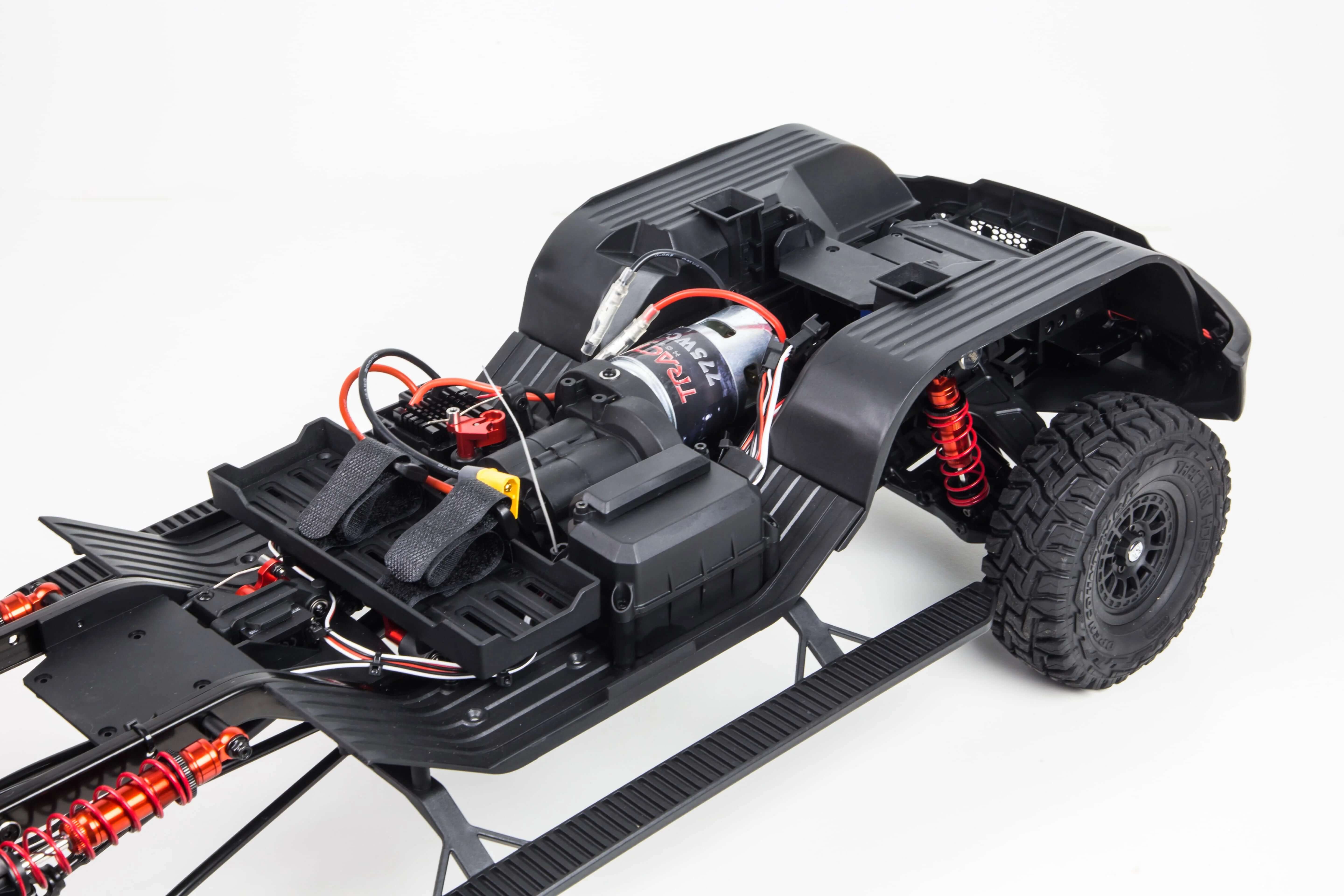Dodge RAM 1500 RC truck climbing over rocky terrain off-road test