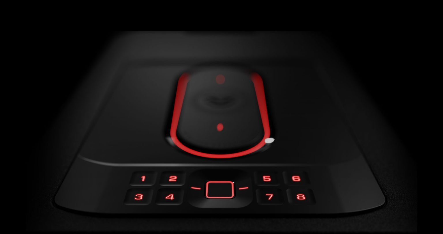 A close-up of a sleek, black device featuring a touchpad and illuminated numeric buttons in red against a dark background.