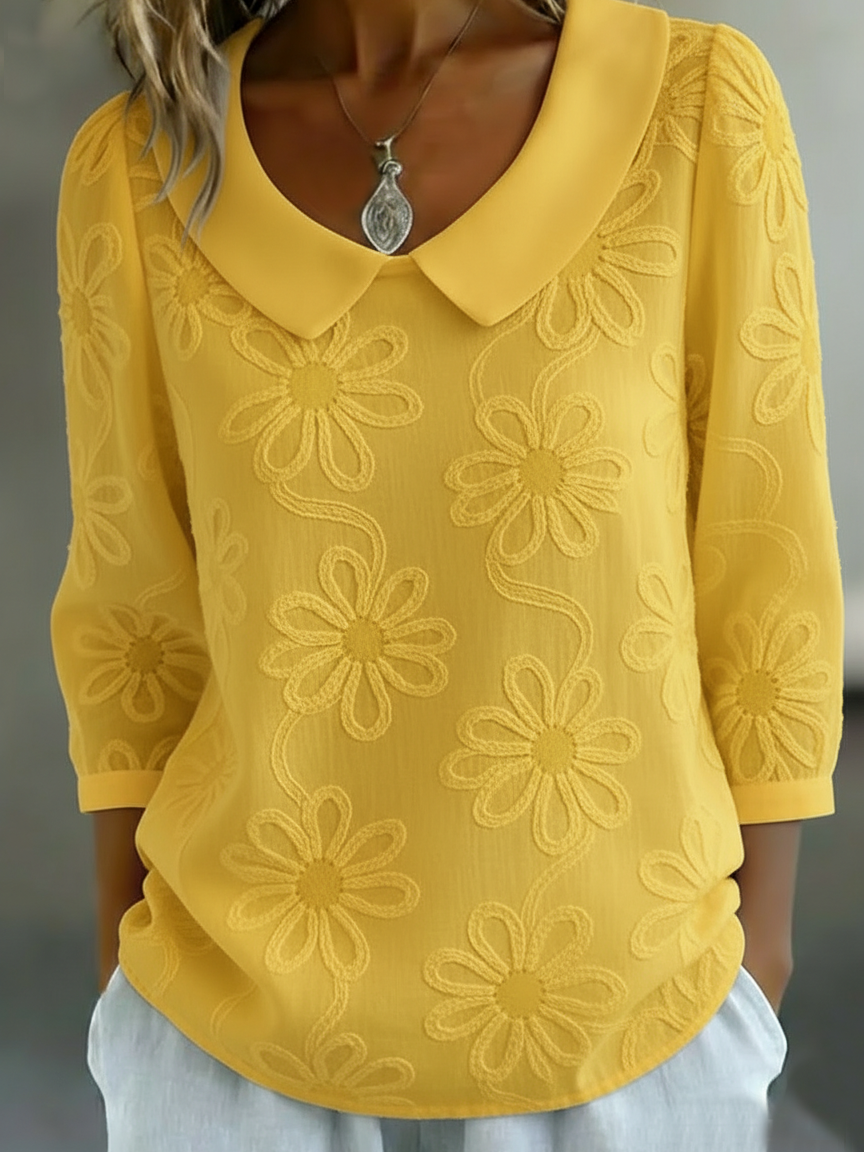 Elegant and comfortable long-sleeve shirt in solid color, decorated with embroidered floral patterns