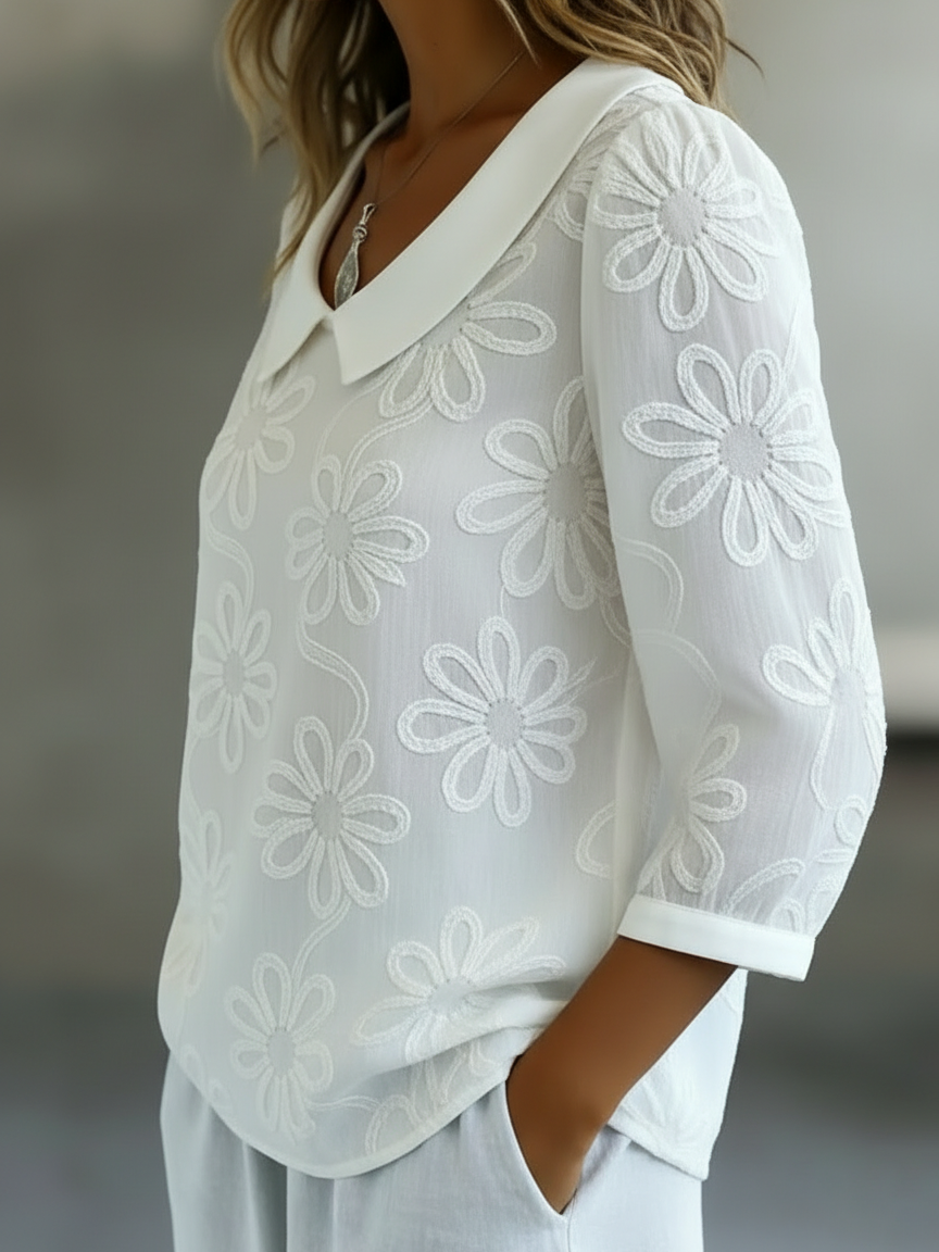 Elegant and comfortable long-sleeve shirt in solid color, decorated with embroidered floral patterns