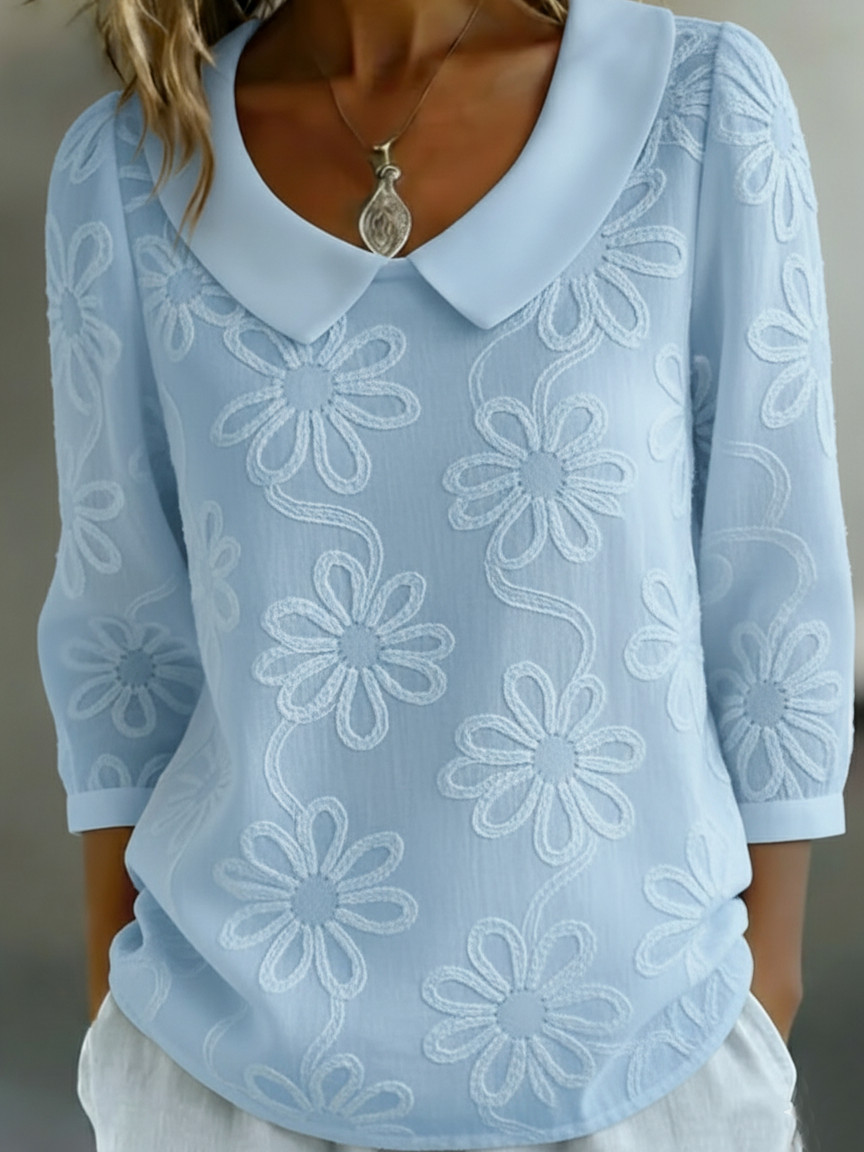 Elegant and comfortable long-sleeve shirt in solid color, decorated with embroidered floral patterns