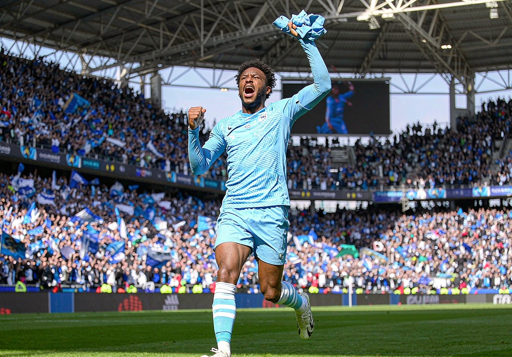 Marseille player celebrating a goal at the Stade Velodrome