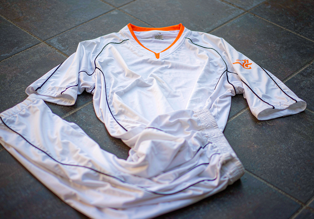 Valencia 2026-27 home shirt on dark concrete with white and black details