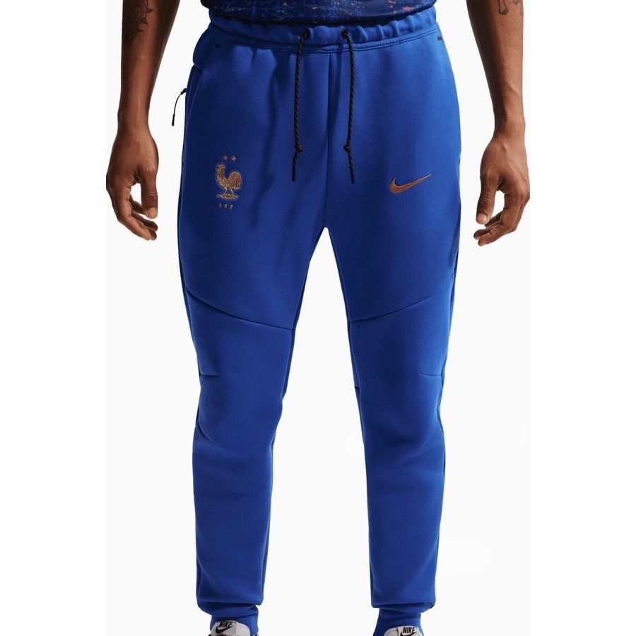 France Sweatpants NSW Tech Fleece World Cup 2026 - Game Royal/Metallic Copper - Men's-SoccerKits Hub | Buy Soccer Jerseys Online
