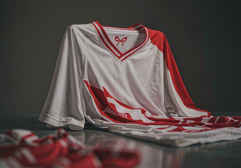 RB Leipzig 2026-27 home shirt on dark concrete with red and white details