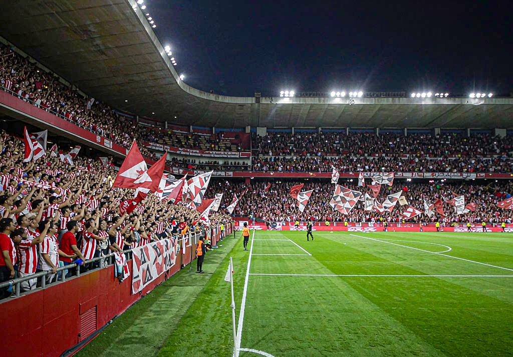 Sevilla fans at Ramon Sanchez-Pizjuan with white and red flags