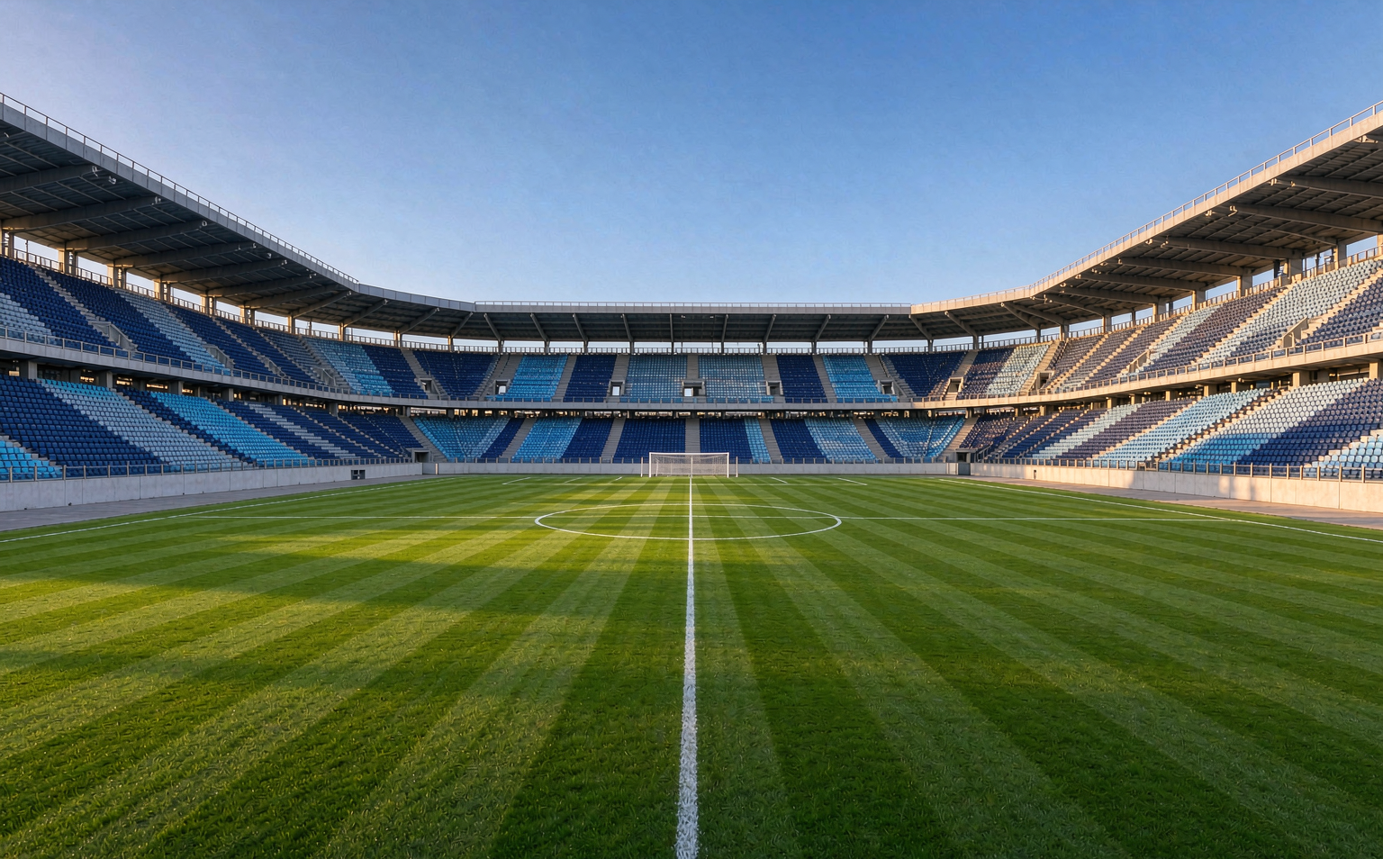 The San Siro pitch under bright afternoon sun