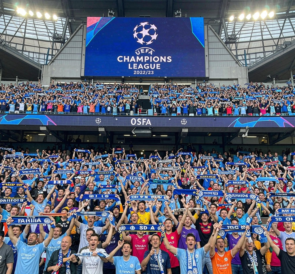 Champions League fans waving scarves across different clubs