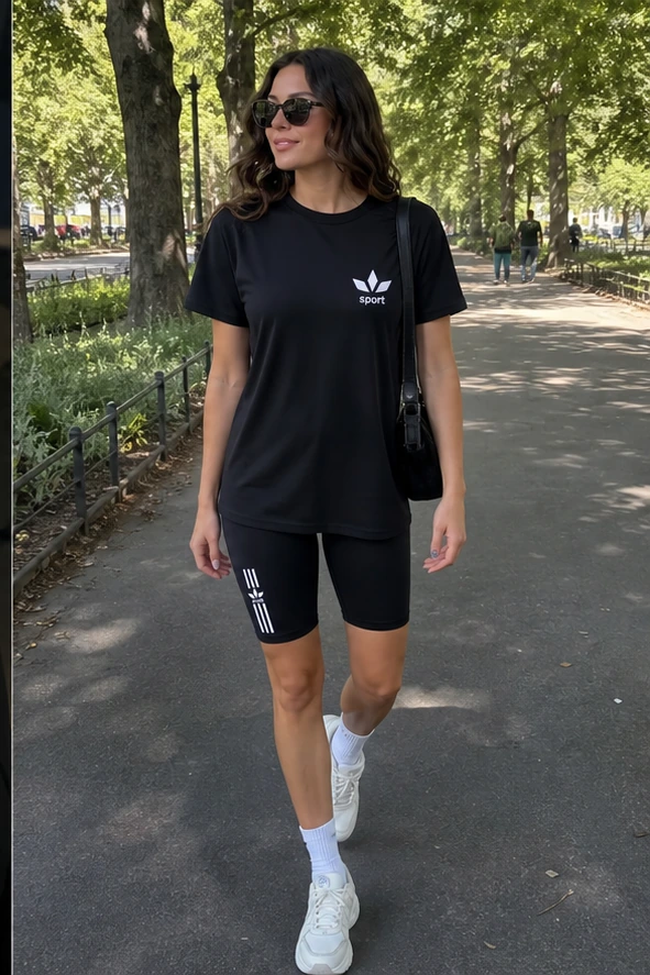 Schwarzes Damen Sport-Set beim Parkspaziergang
