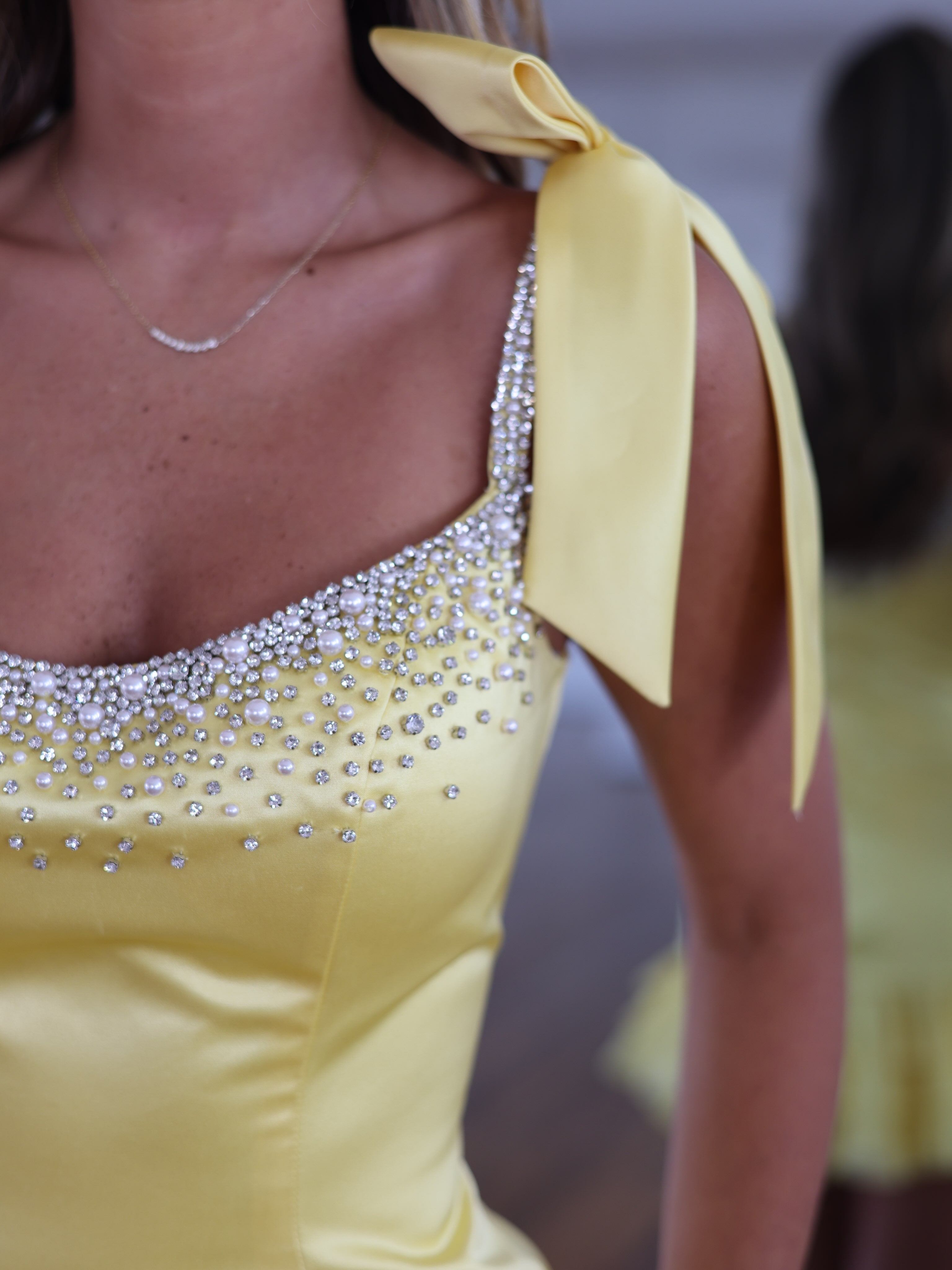 Yellow satin pearl rhinestone bow strap tiered ruffle mini homecoming dress - pearl rhinestone neckline and bow strap detail