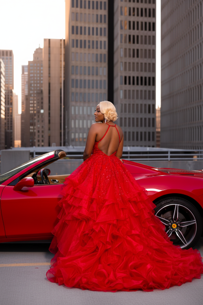 Red halter crystal beaded mermaid prom dress with ruffled organza skirt - back view showing open halter back