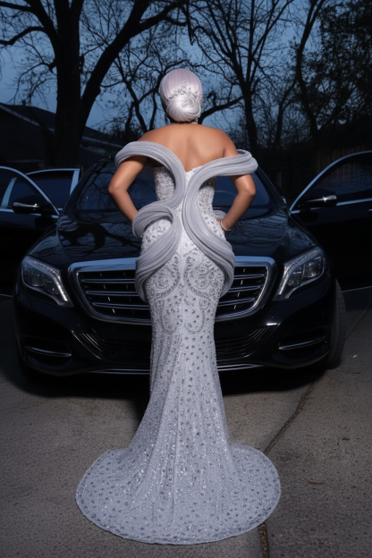 Silver grey 3D sculptural spiral wave off-shoulder crystal beaded mermaid prom dress - back view showing spiral wave ruffles wrapping back bodice silver crystal arabesque pattern sweep train black Maybach twilight