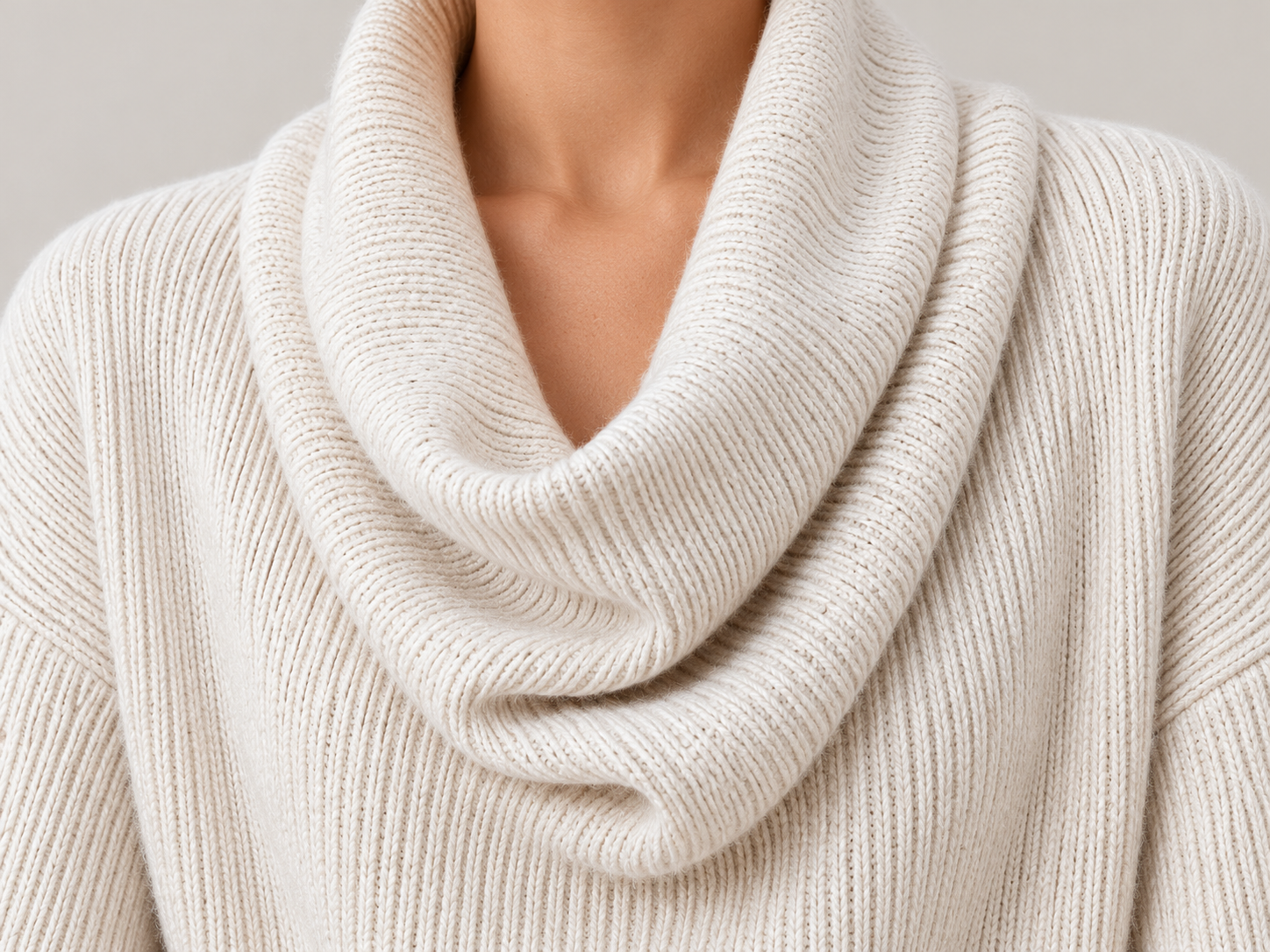 Close-up of the sweater's layered cowl collar and vertical rib knit