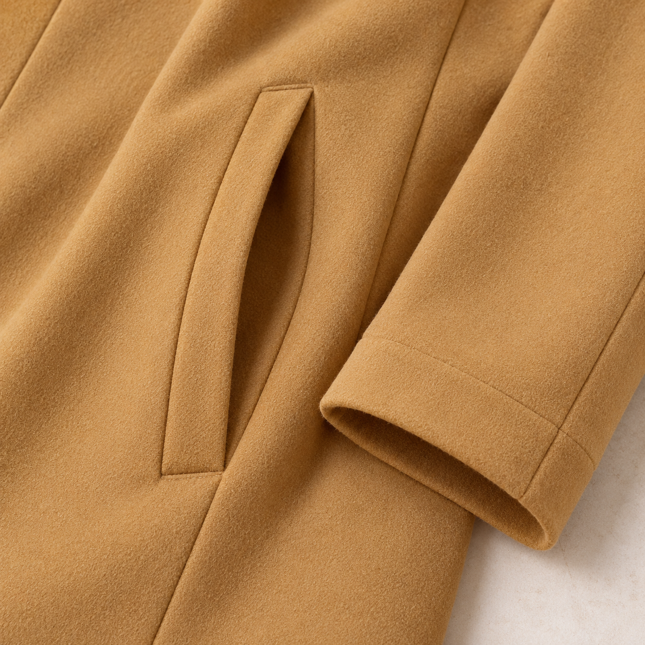 Close view of the Yellow jacket fabric, inset hip pocket and sleeve cuff seam