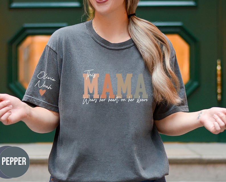 Custom This Mama Wears Her Heart On Her Sleeve Shirt, Personalized Mom Shirt With Kids Names, Mom Tshirt, Mothers Day Gift