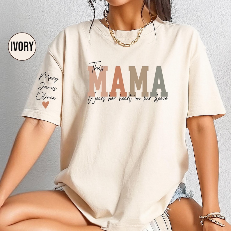 Custom This Mama Wears Her Heart On Her Sleeve Shirt, Personalized Mom Shirt With Kids Names, Mom Tshirt, Mothers Day Gift