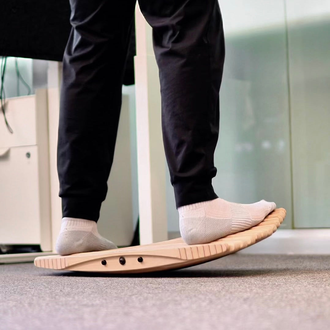 Wooden balance board for standing desks