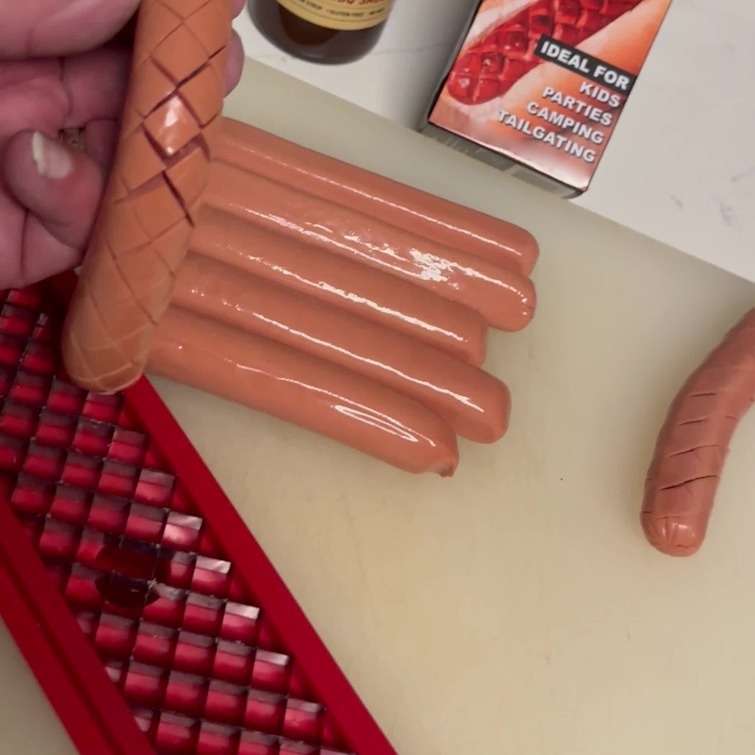 Stainless steel hot dog slicing tool