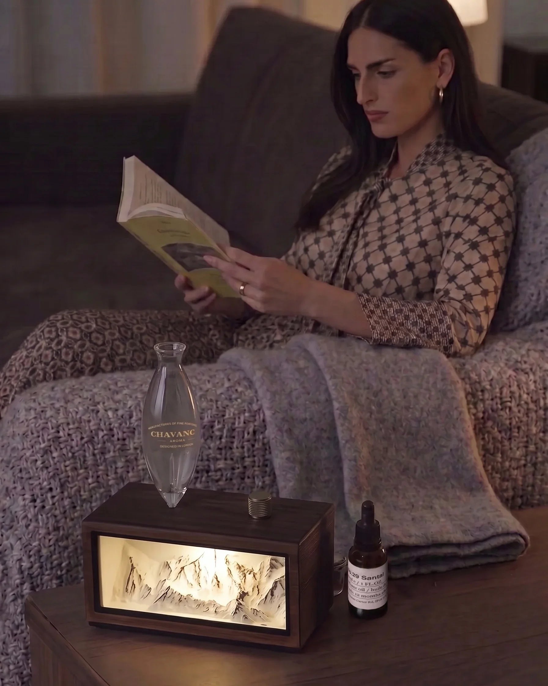 Chavanc Alpine Monument waterless essential oil diffuser in dark walnut wood during evening reading routine