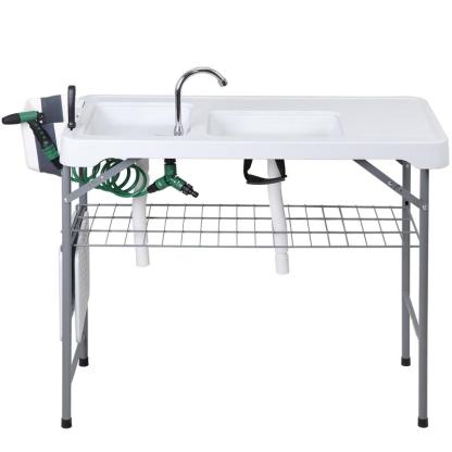 Estación de preparación multiusos para exteriores «Todo en 1» — Mesa ligera, portátil y plegable (PE y acero) con patas abatibles, doble fregadero, grifo y rejilla de soporte. Capacidad de carga de 660 lb. Ideal para la limpieza de pescado, barbacoas y ca