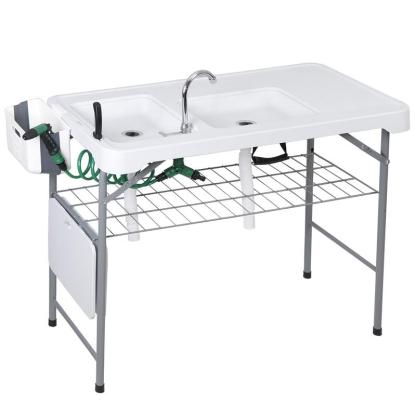 Estación de preparación multiusos para exteriores «Todo en 1» — Mesa ligera, portátil y plegable (PE y acero) con patas abatibles, doble fregadero, grifo y rejilla de soporte. Capacidad de carga de 660 lb. Ideal para la limpieza de pescado, barbacoas y ca