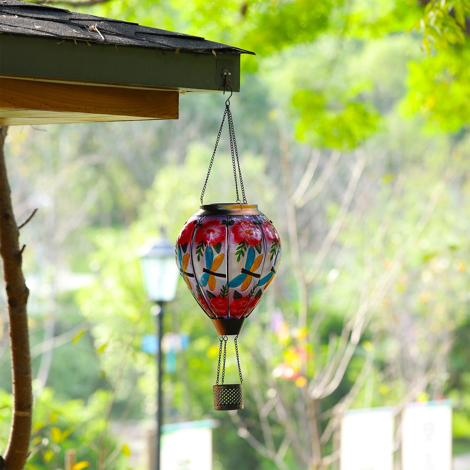 Dragonfly-themed hot air balloon solar lantern lighting up the backyard, perfect for yard decorations and garden solar lights