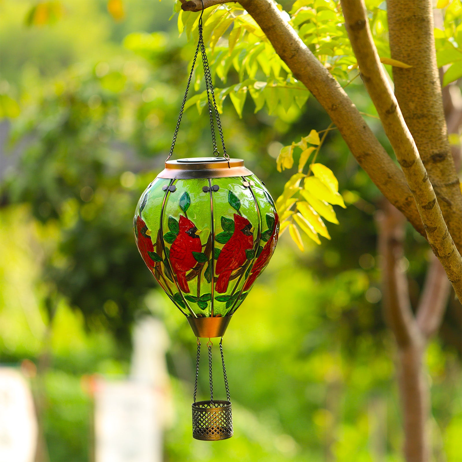 Solar lantern with hand-painted cardinal bird in red hues, perfect for front yard decor and patio solar lighting