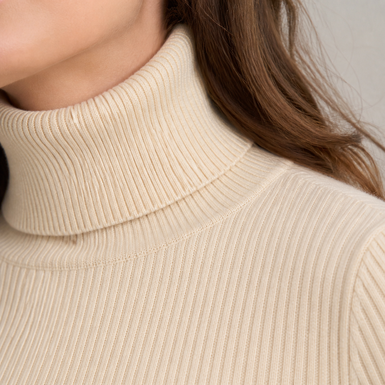 Close-up of ribbed mock-neck construction