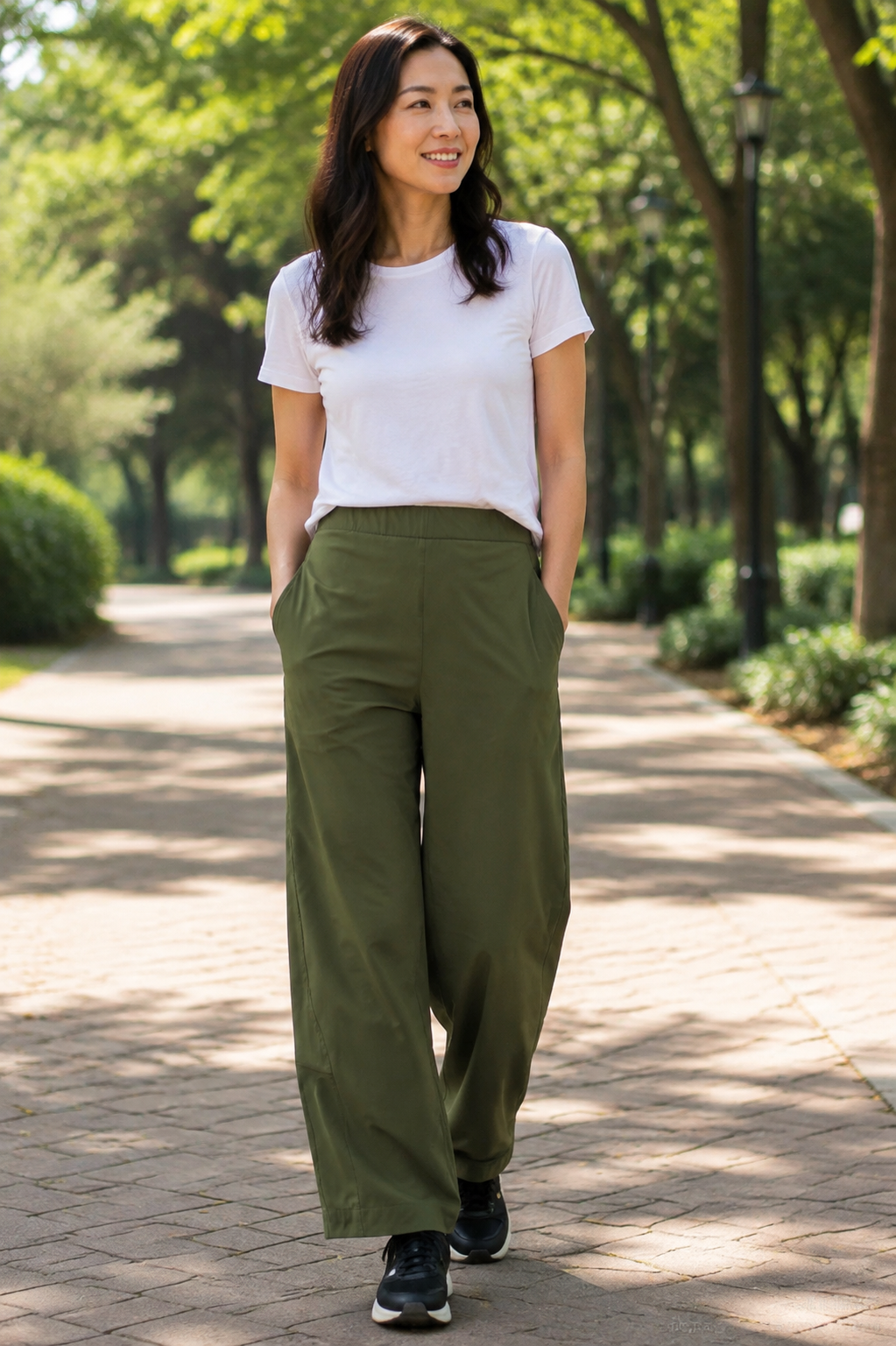 Olive Aria pants in a park