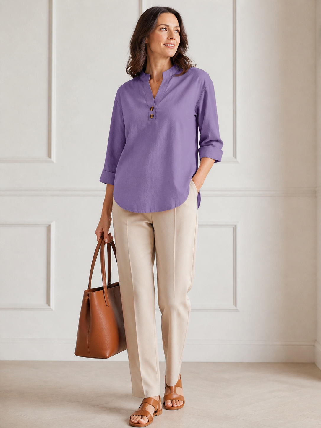 Elara blouse styled with cream trousers