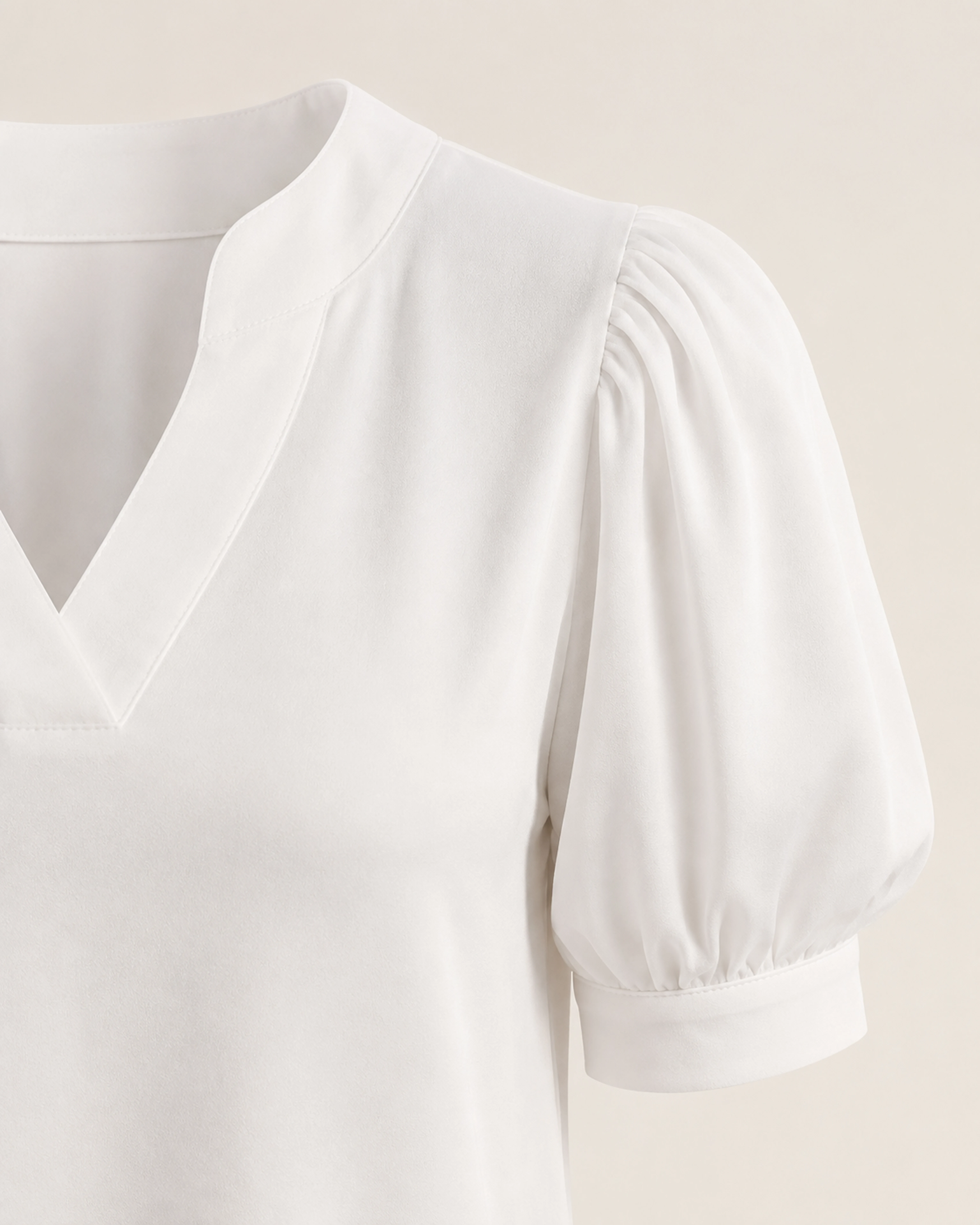 Close-up of the Mara puff sleeve and fitted cuff construction