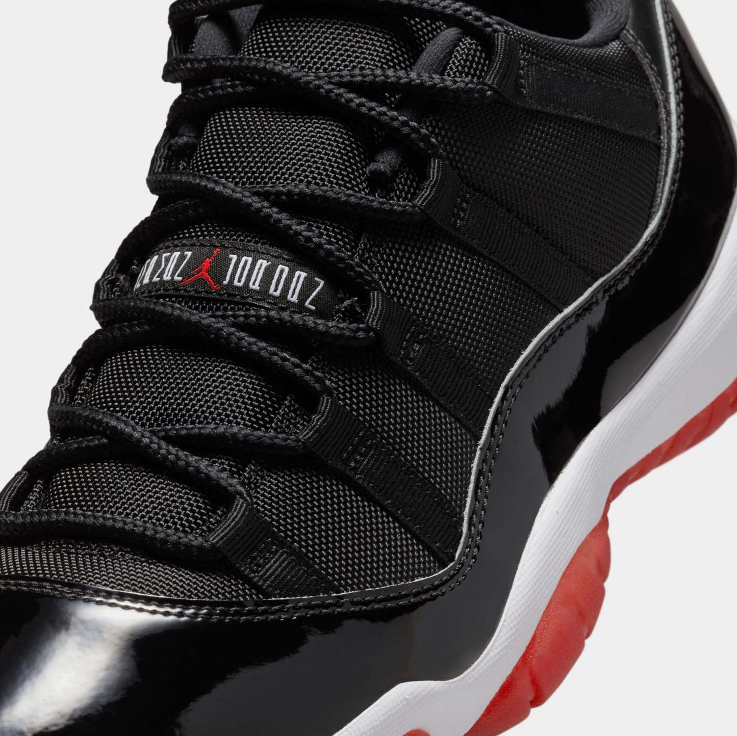 Air Jordan 11 Retro Low Bred Mens Lifestyle Shoes (Black/Varsity Red/White)