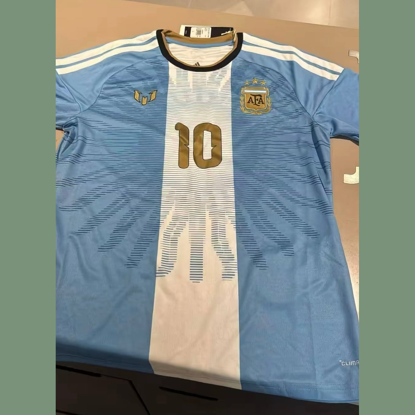2026 Argentina Messi farewell special edition shirt, flat lay with the gold 10