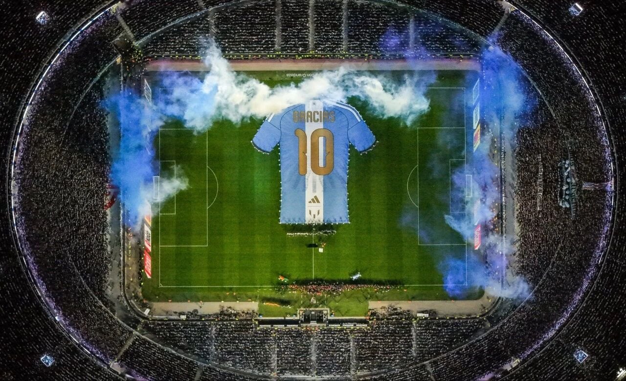 A giant replica shirt laid out on the pitch before Argentina vs Benin