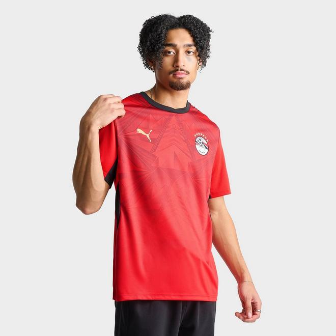 Egypt national team player wearing red home jersey